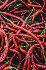 red chili peppers on a wooden background