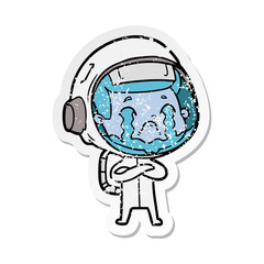 distressed sticker of a cartoon crying astronaut