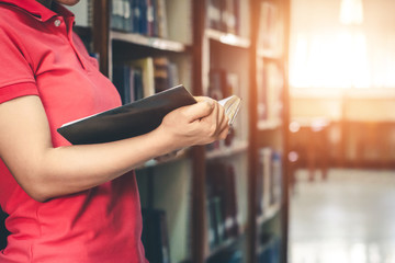 Women read holiday books in a quiet environment.