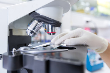 Scientist using a microscope in a laboratory,Concept science and Technology