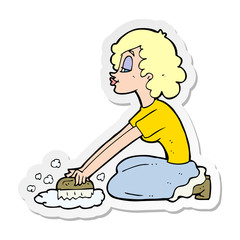 sticker of a cartoon woman scrubbing floor