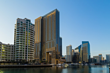 Fototapeta na wymiar Dubai marina towers, boats and skyscrapers