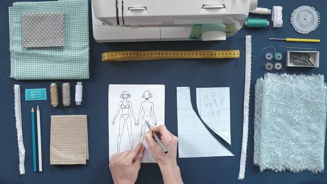 desktop seamstress, designer lingerie, top view, purple background