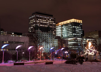 Fototapeta na wymiar Marion Dewar Plaza Ottawa City Hall at night in winter with Canada 150th birthday cauldron flame