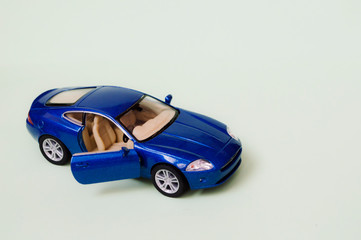  blue sports toy car on a light background