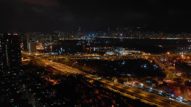 night illuminated hong kong kowloon cityscape traffic port aerial topdown panorama 4k 