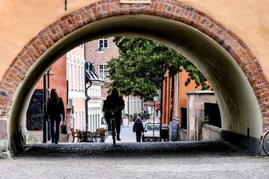 UPPSALA, SWEDEN A woman bikes through a vault in downtown.