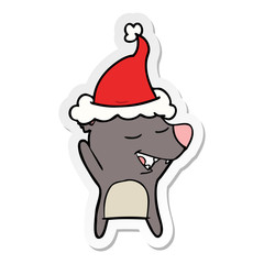 sticker cartoon of a bear wearing santa hat