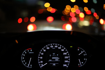 speedometer in modern vehicle car drive travel road trip in night city