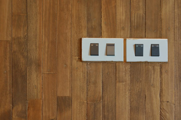 button switch on and off light on wooden wall