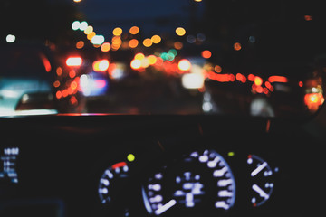 light of traffic jam on night street, image blur urban road background