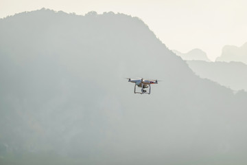 UAV drone copter flying with digital camera.Drone with high resolution digital camera. Flying...