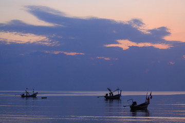 Sunset view of the tropical Island. Boats on the sea. Ko Samui. Thailand