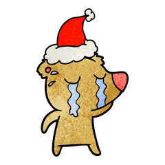 textured cartoon of a crying bear wearing santa hat
