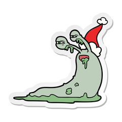 gross sticker cartoon of a slug wearing santa hat
