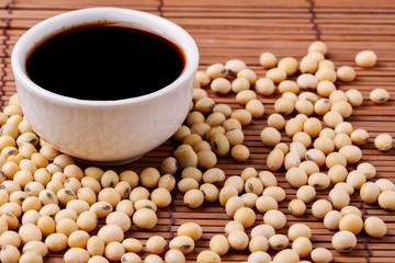soy sauce and soybeans on the table