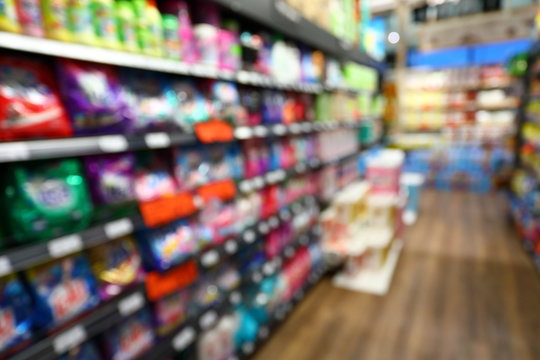 goods shelf in business supermarket, image blur background