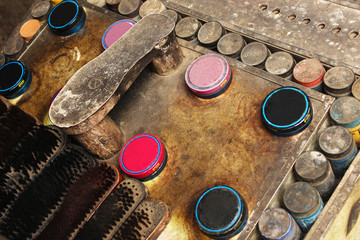 Shoe stand, brushes and shoe polish box on street, Maharashtra, India.