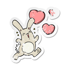 Obraz na płótnie Canvas distressed sticker of a cartoon rabbit in love