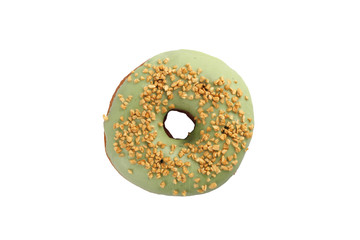 Appetizing donut with pistachios on a white background. Isolated.