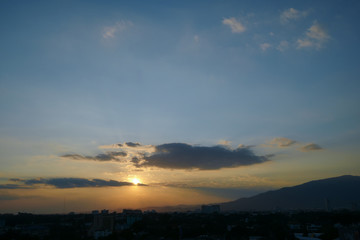Fototapeta na wymiar beautiful dramatic sunset sky above the city skyline