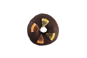 Appetizing donut with dark chocolate icing and marmalade decoration on a white background. Isolated.