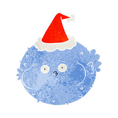 retro cartoon of a puffer fish wearing santa hat