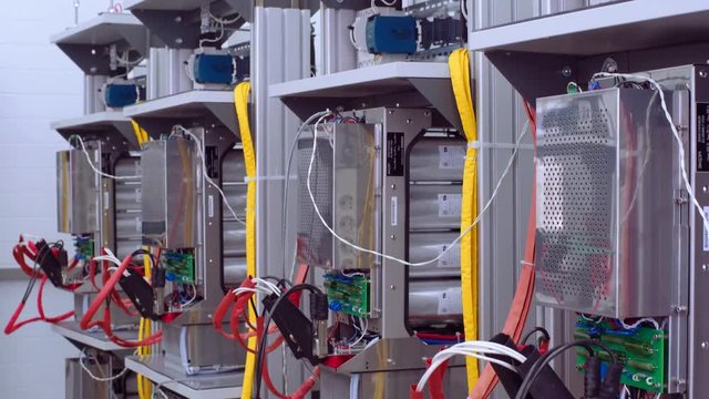 Test benches in the laboratory for the production of microprocessor-based protection and automation devices. Wires with clamp close up.