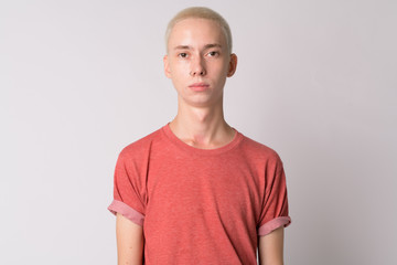 Face of young handsome androgynous man with nose ring