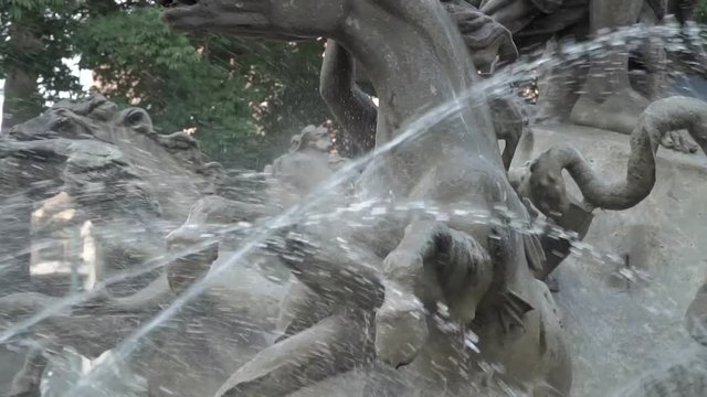 Slow motion water jets spraying on horse sculpture at Fontana Di Proserpina in Catania, Italy