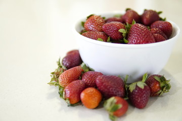 delicious strawberrys freshly cut on granite table