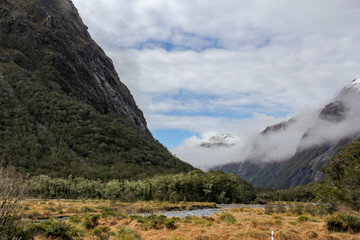 new zealand landscape with mountains and clouds