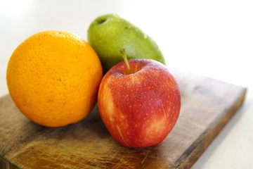 orange pear and apple prepared for a fresh and nutritious salad