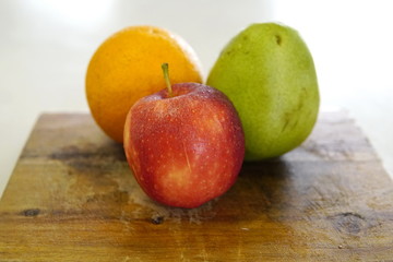 orange pear and apple prepared for a fresh and nutritious salad