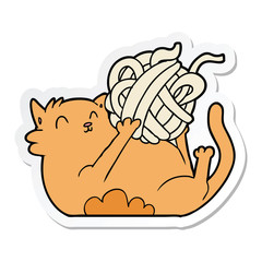 sticker of a cartoon cat playing with ball of string