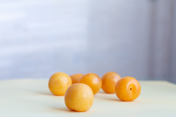 Yellow plums on a table