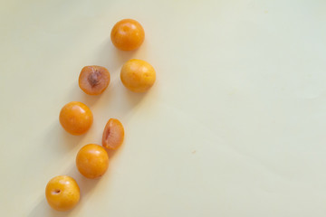 Yellow plums on a table