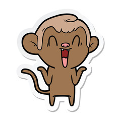 sticker of a cartoon laughing monkey