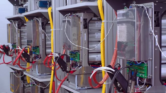 Test benches in the laboratory for the production of microprocessor-based protection and automation devices. Wires with clamp close up.