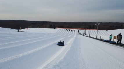 Tubing in Snow park, winter activities. 