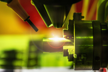 laser processes the metal part in the laboratory or in production