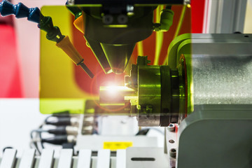 laser processes the metal part in the laboratory or in production