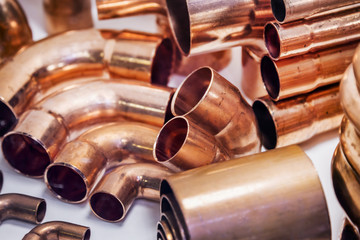 copper pipes of different diameter and sizes and adapters