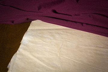Purple fabric and vintage paper