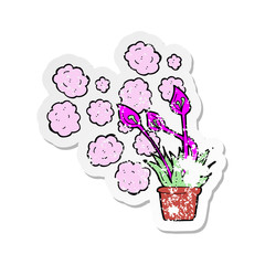 retro distressed sticker of a cartoon excotic flowers
