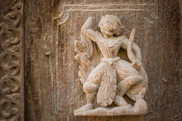 Archaeological, Close Up of carved art figures on old wood carvings on the wall temple at Shwe Nan Daw Kyaung (Golden Palace Monastery) in Mandalay, Myanmar