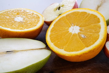 orange pear and apple prepared for a fresh and nutritious salad