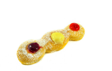 Close up of long donuts with white sugar and jam blueberries cream strawberry jelly tasty