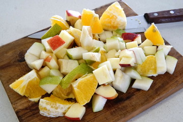 orange pear and apple prepared for a fresh and nutritious salad