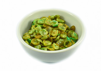 Cooked baked salt broad beans in cup isolated on white background - Wasabi beans green